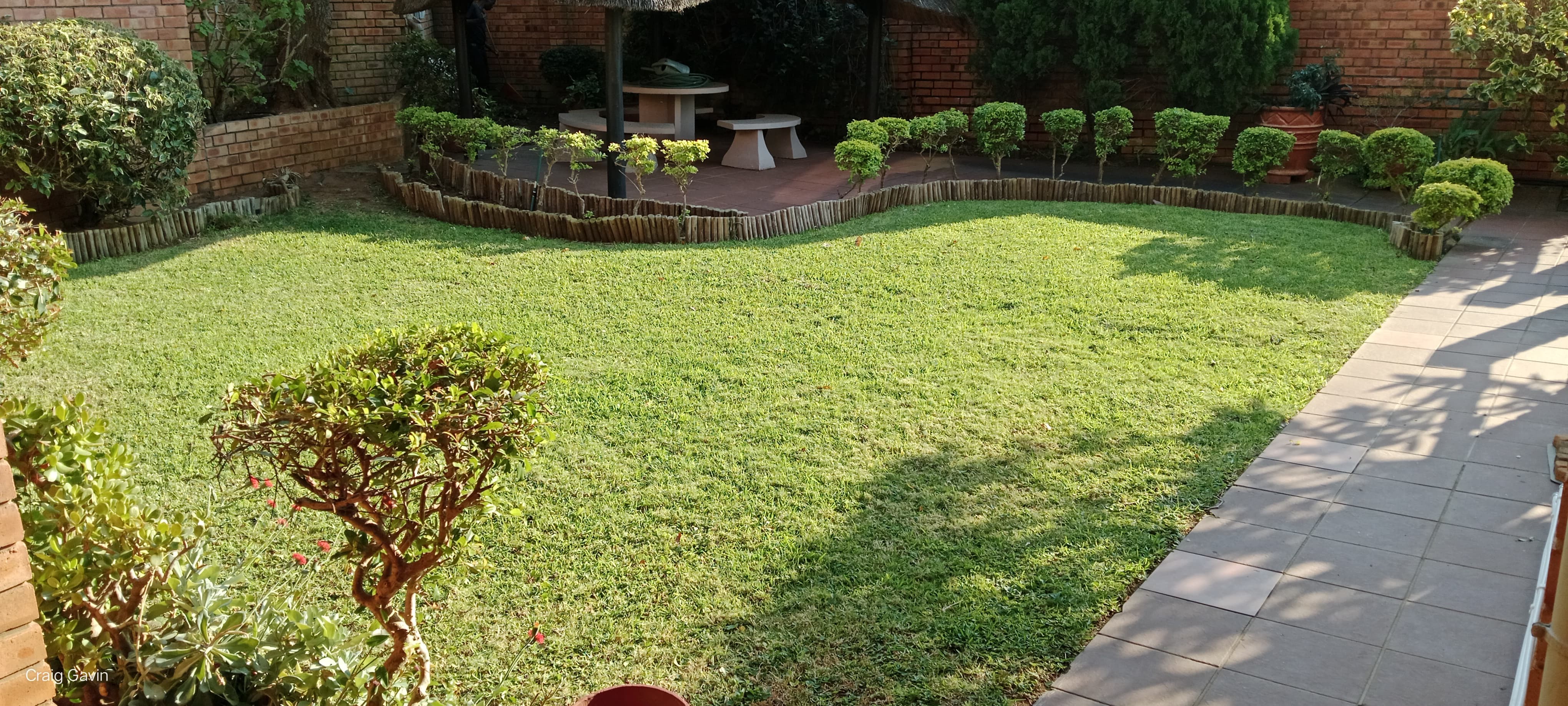 Big Bee crew working a manicured garden in Ballito
